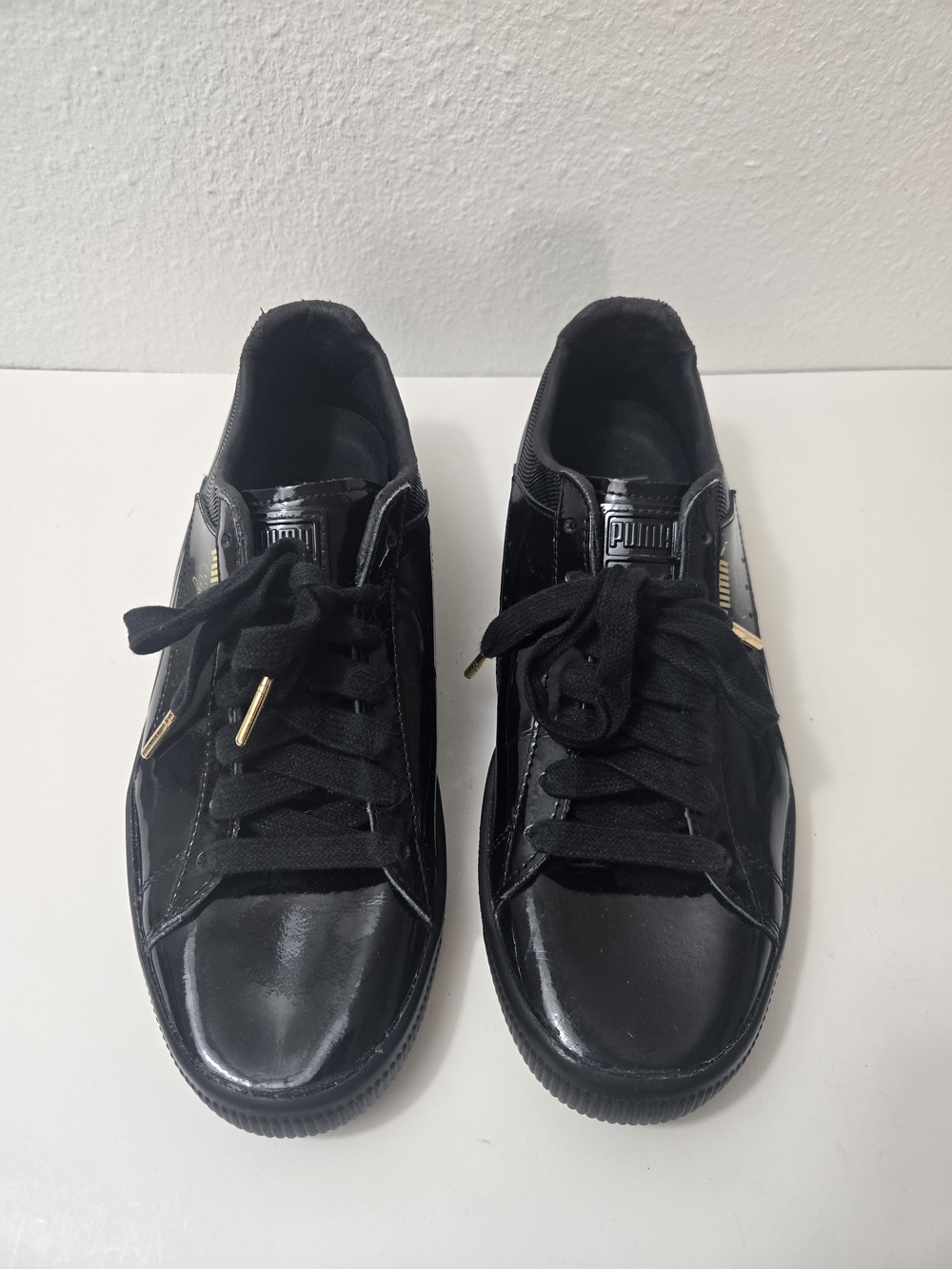 Puma Men's Black Patent Sneakers with Gold Accents